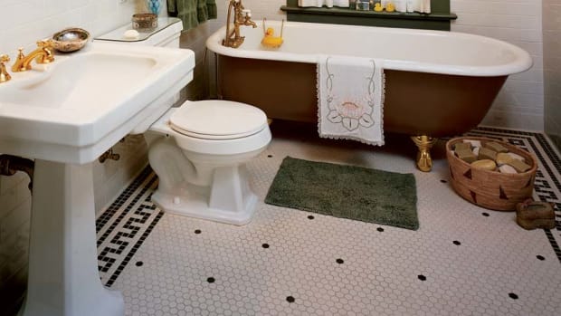 Small hexagon-shaped floor tiles are a bathroom standard; note the Greek key border in square mosaics.