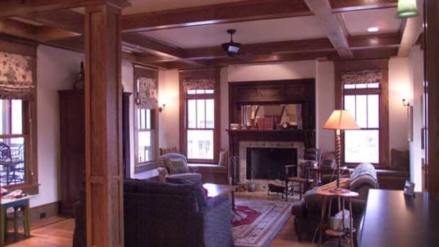 Interior elements are quintessential Craftsman bungalow style, including box beams and colonnades with tapered square columns.