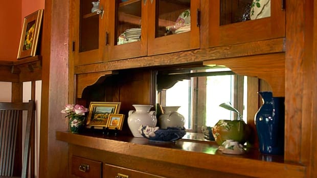 The built-in buffet of Douglas fir is a notable feature with fine details: hexagonal pilasters with a heavy lintel, flared serving shelf, beveled mirror.