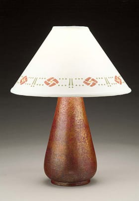 Stenciled lampshade by Helen Foster tops a hammered copper lamp from Cobre.