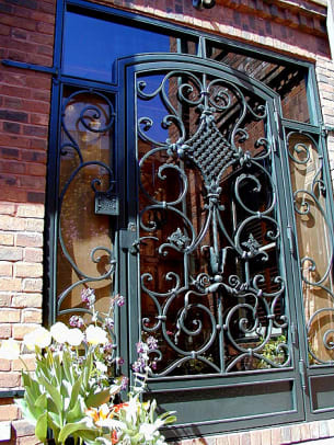 Iron and glass door with sidelights by Lowell Chaput Metalsmiths