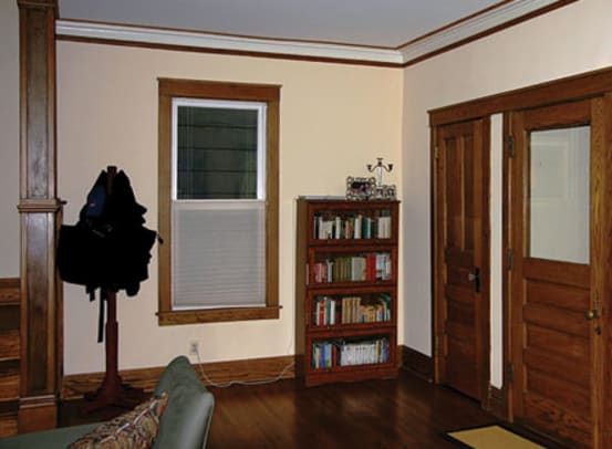 Floor, walls, and ceiling are separate entities in an entry hall with bits of unrelated furniture and little style.