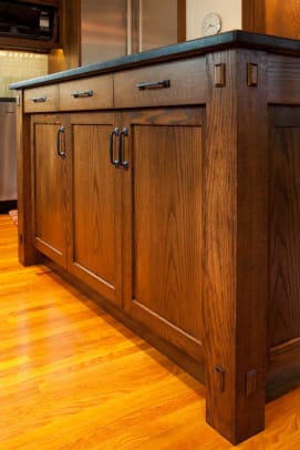 New cabinets complement the existing woodwork of the home.