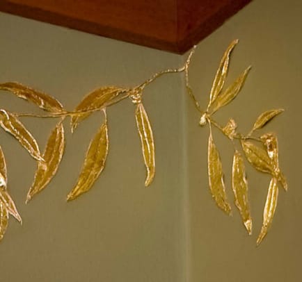 Gilded eucalyptus leaves were done in gesso.
