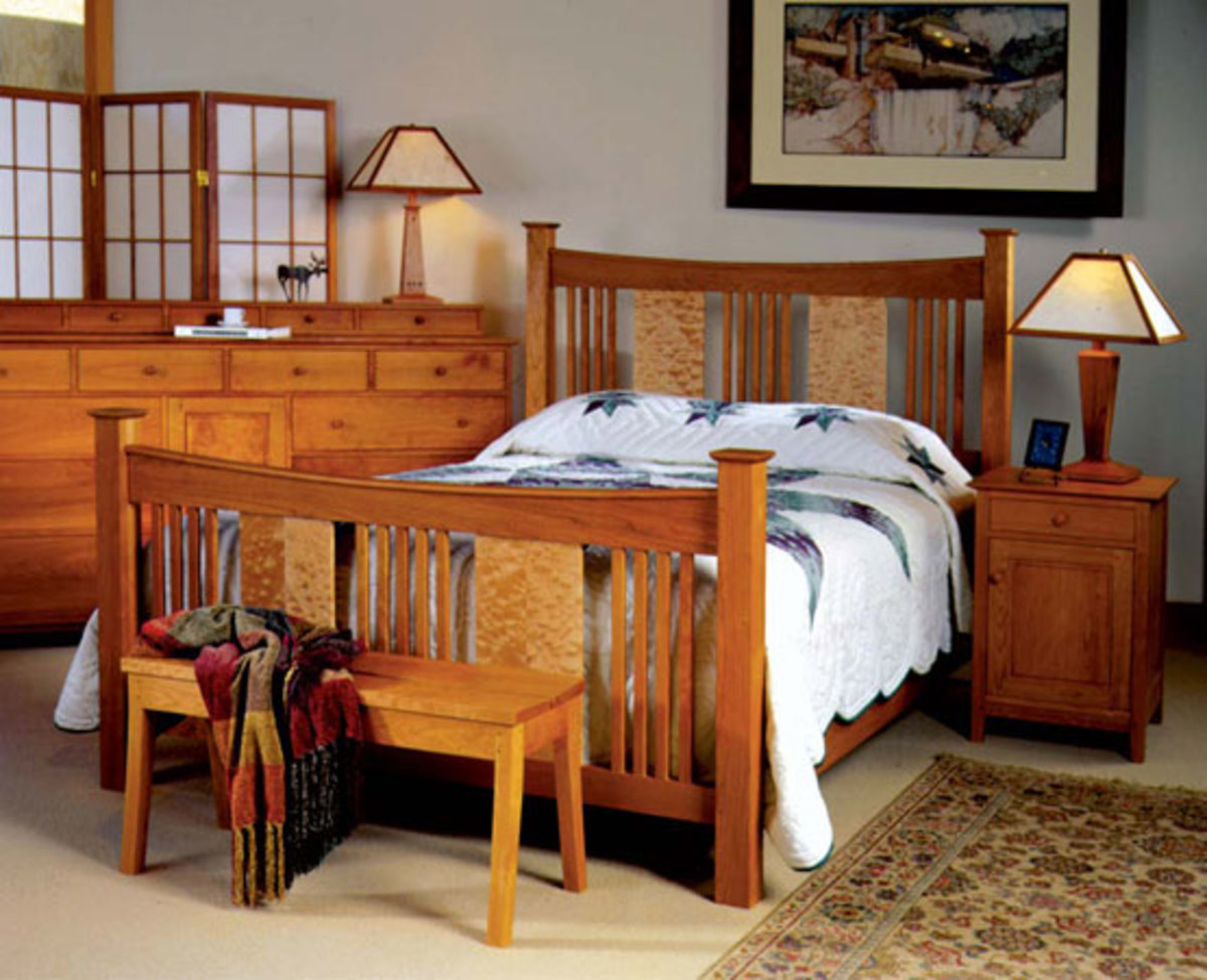 The Joinery’s “Sorenson Reverse Deluxe Bed” in cherry with quilted maple panels shown with Dunning nightstand and Grider dresser.