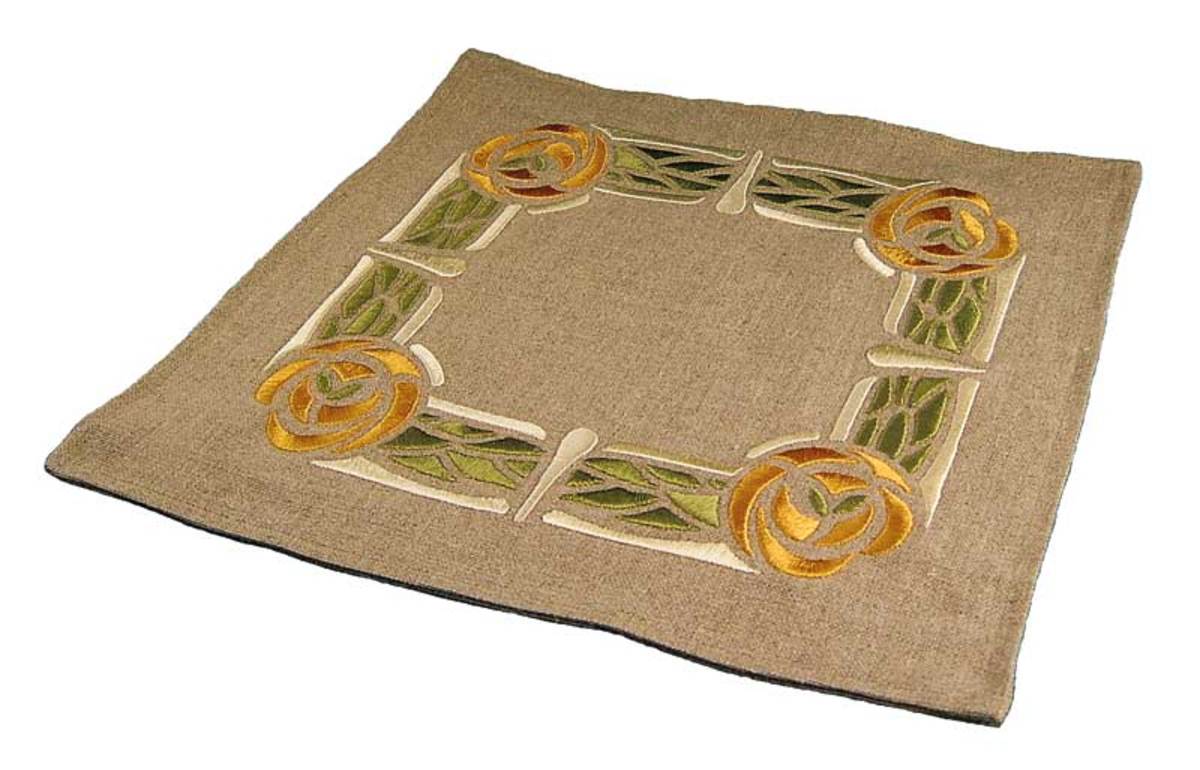 The embroidered tabletop linen is recent work, from Ford Craftsman Studios.