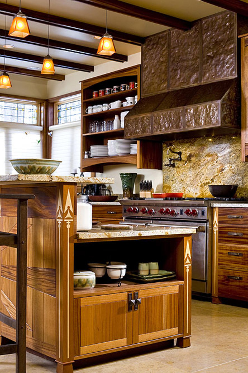 With a counter-height back, the large island acts as a fourth wall to separate the kitchen from the living area.