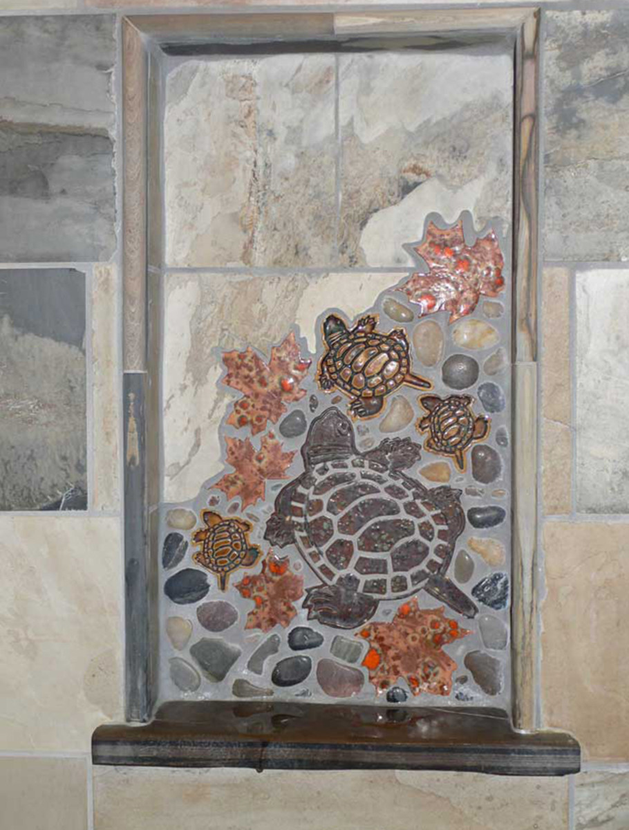 A collage of free-form tiles decorates the shower niche.