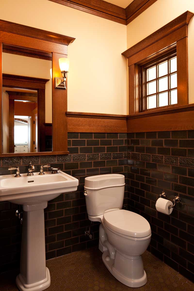WIth its richly-colored tile, the powder room has an Arts & Crafts feeling.