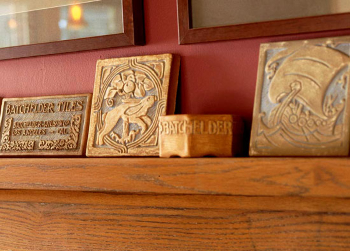 Antique Batchelder tiles on a mantel, from a private collection. Photo by Susan Gilmore.