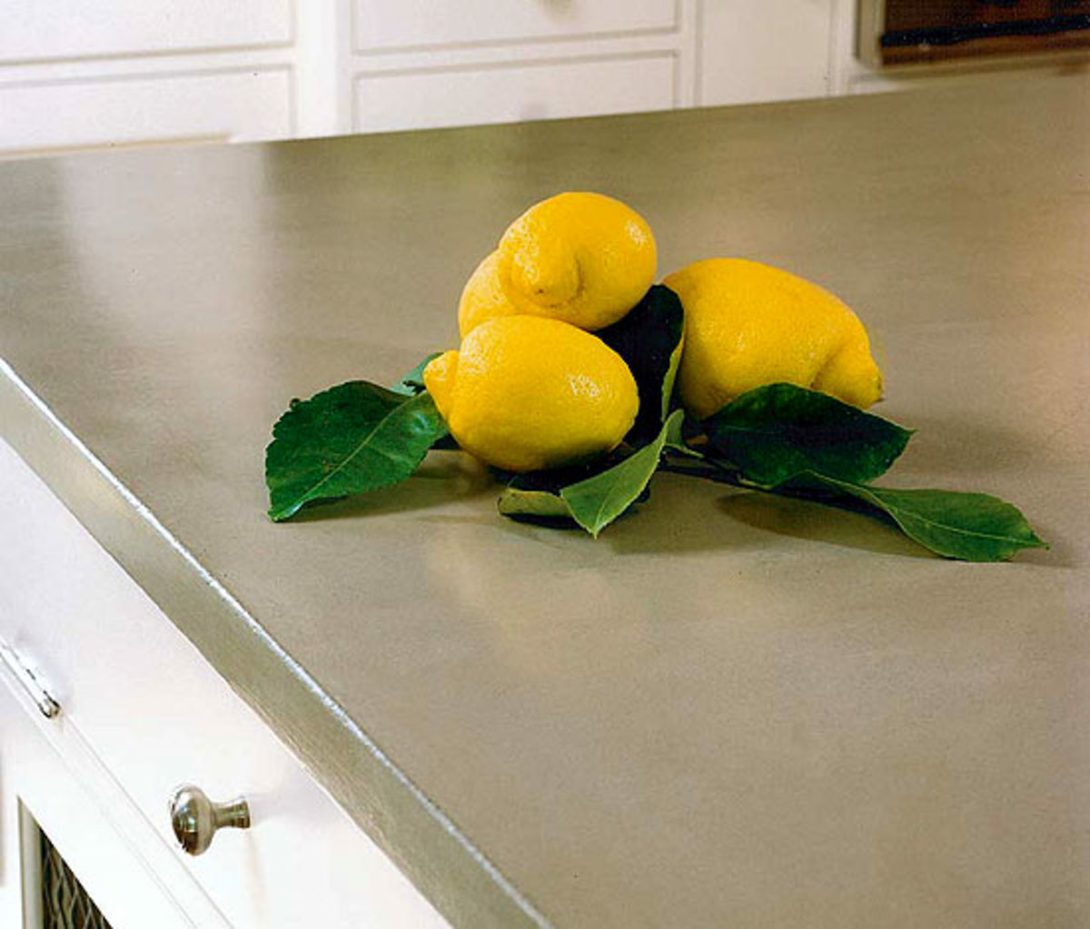This soft-colored countertop is custom-finished concrete.