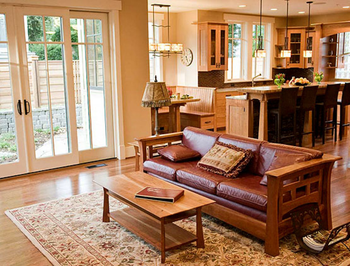 Arts & Crafts furniture, French doors, and cabinets with cloud-lift details are period inspired.