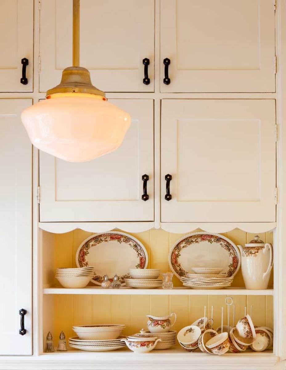 white cabinets with wrought-iron pulls