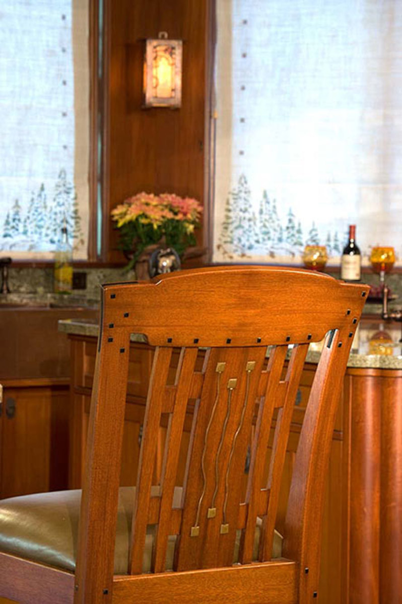 Cabinetmakers Jim Nelson and David Bautista built the mahogany bar stools inlaid with copper and brass with ebony accents. (Hamilton Cabinets, Petaluma, CA: hamiltoncabinets.net)