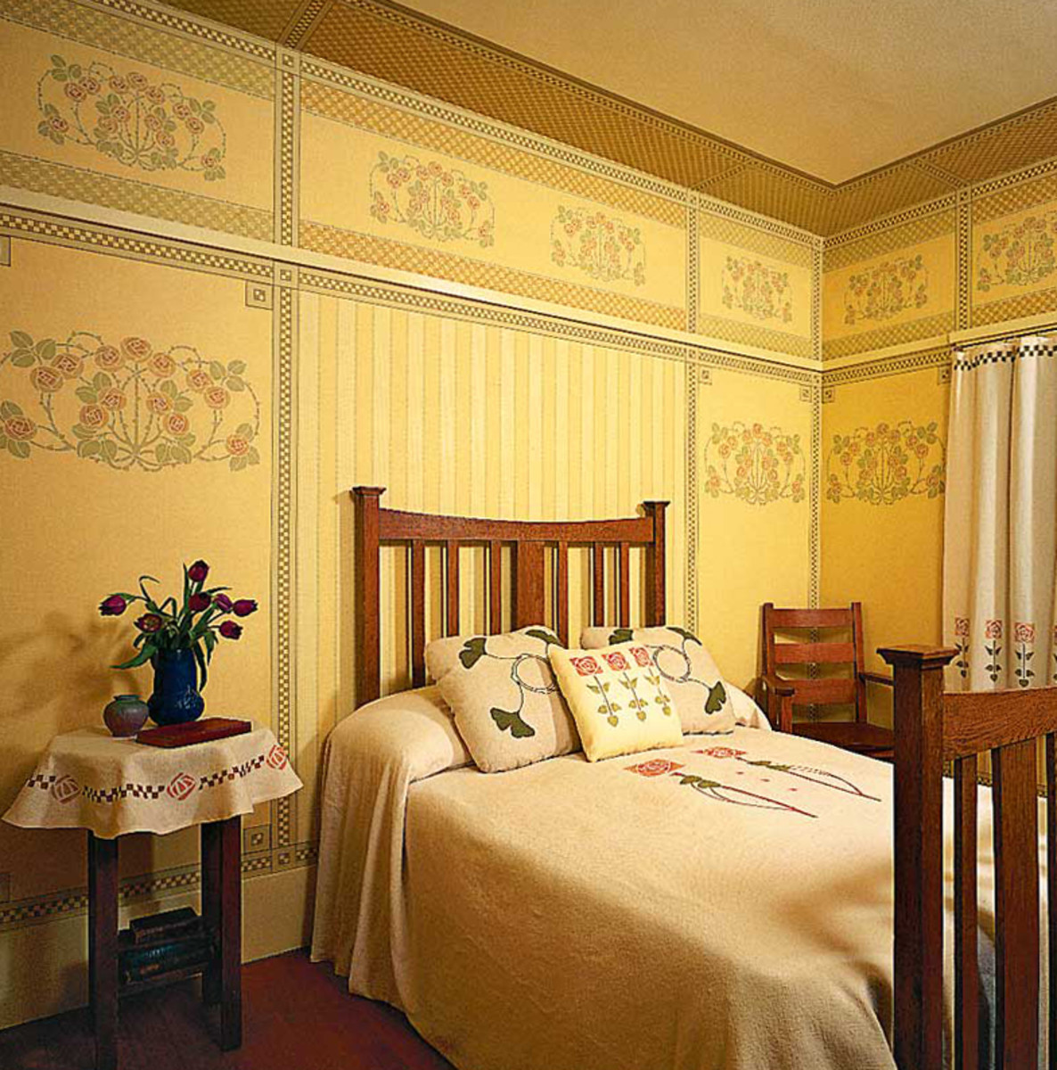 Stylized rose and striped papers reproduced by Bradbury for the Burnaby Village farmhouse in British Columbia. Hung as a frieze and panels, the papers create a post-Victorian room set.