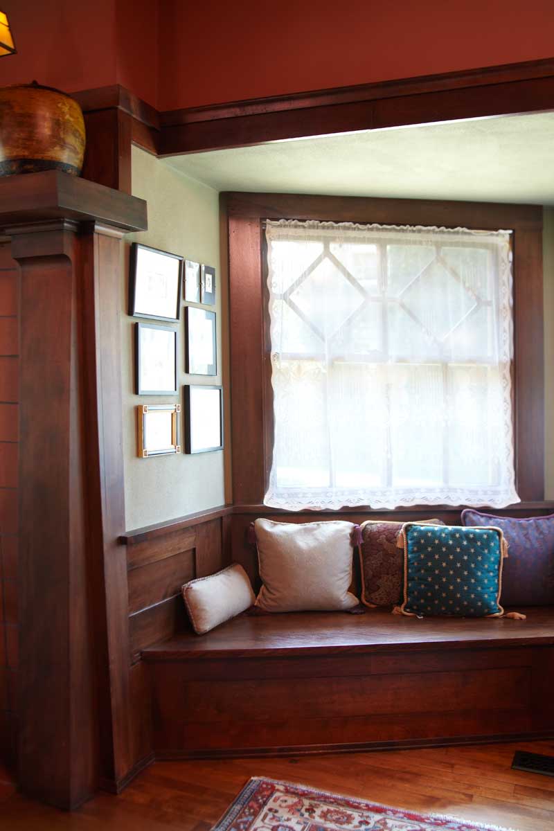Original millwork in a 1908 Prairie-style house includes this window seat in a bay. Photo: Scott Van Dyke