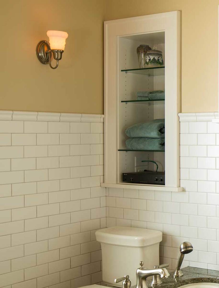 Following vintage examples, shelves recessed into the wall between studs provide handy storage.