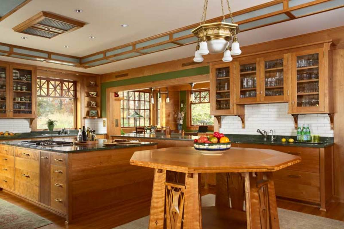 A large buffet anchors one end of the room, which opens to a dining area on the sunset porch.