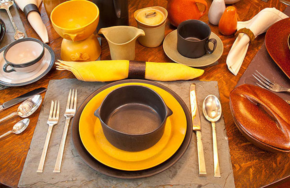 An Arts & Crafts house sets an eclectic table, mixing in dinnerware from later eras. Common elements are matte glazes and earthy colors. Russel Wright dinnerware is flanked by Community Silver flatware in the 1948 pattern ‘Morningstar’. The teapot is a contemporary Swedish piece. The tall 1960s coffeepot is from Bennington Pottery. The small cup and saucer are unmarked A&C-era pieces. Photo by Bruce Martin.