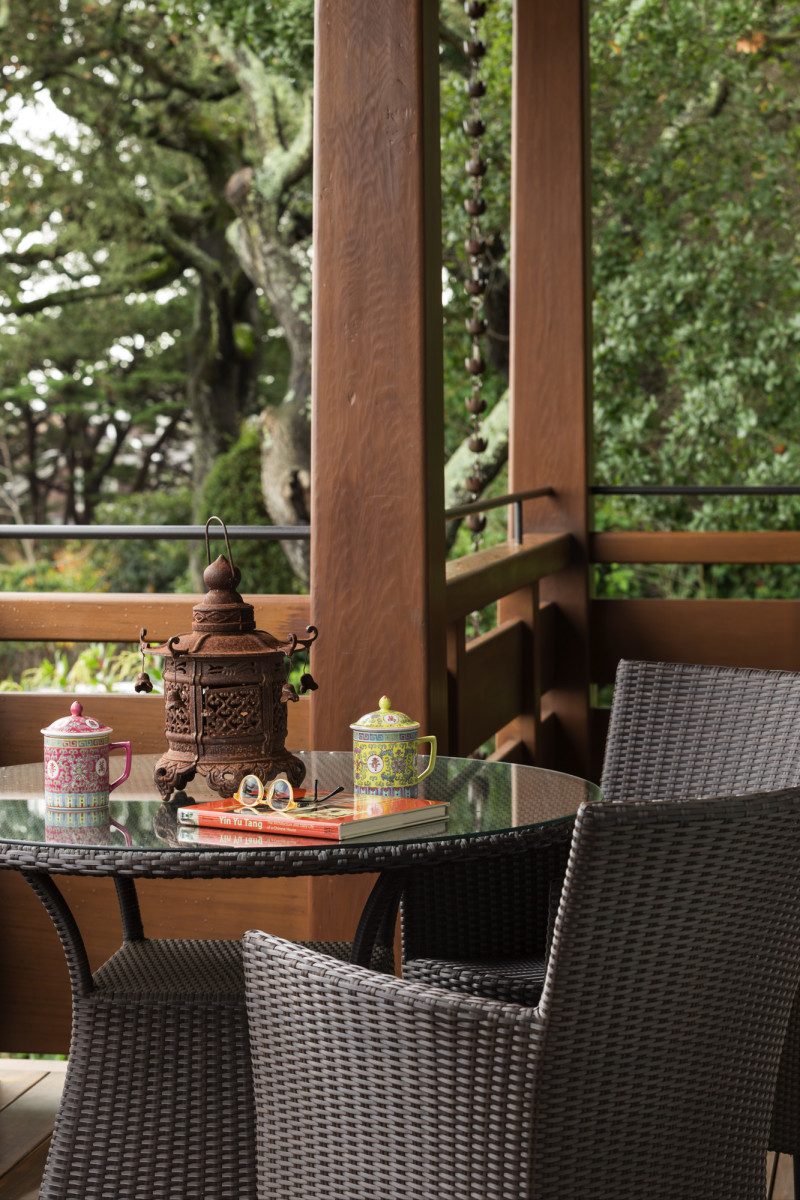 The terrace overlooking the bay is a perfect spot for tea. Live oaks form a canopy on the north side of the house.