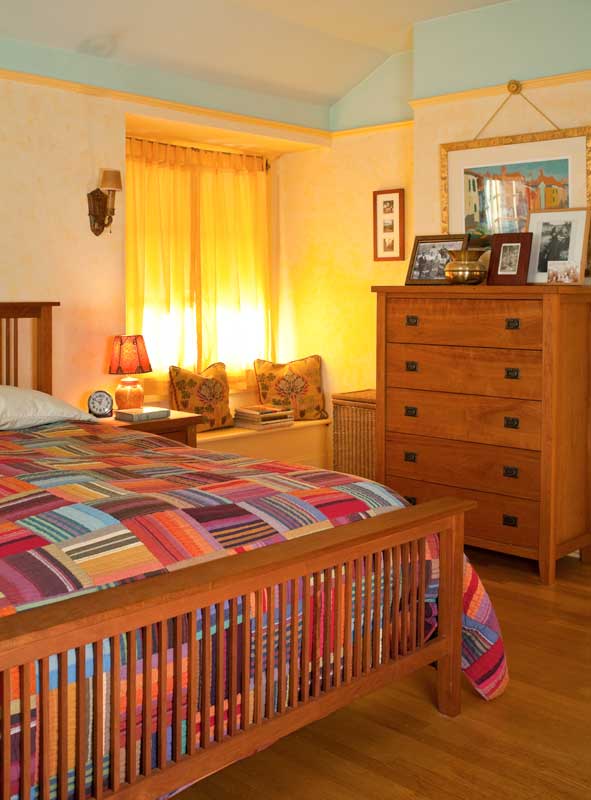 the-bedroom-is-furnished-with-arts--crafts-revival-pieces-in-cherry.jpg