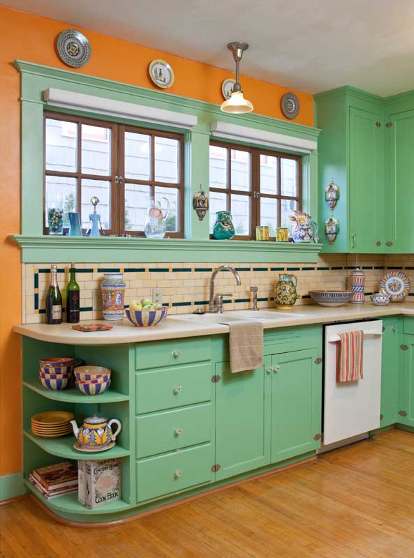 a-fearless-use-of-period-colors-is-evident-in-the-kitchen-the-maple-strip-flooring-top-nailed-replicates-the-original-damaged-in-a-1920s-woodstove-fire.jpg