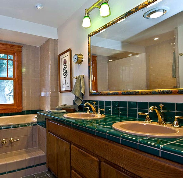 a-decorative-sconce-is-supplemented-by-directed-spots-and-a-ceiling-fixtures-in-a-bathroom-where-the-lighting-is-flexible-photo-by-chris-considine.jpg
