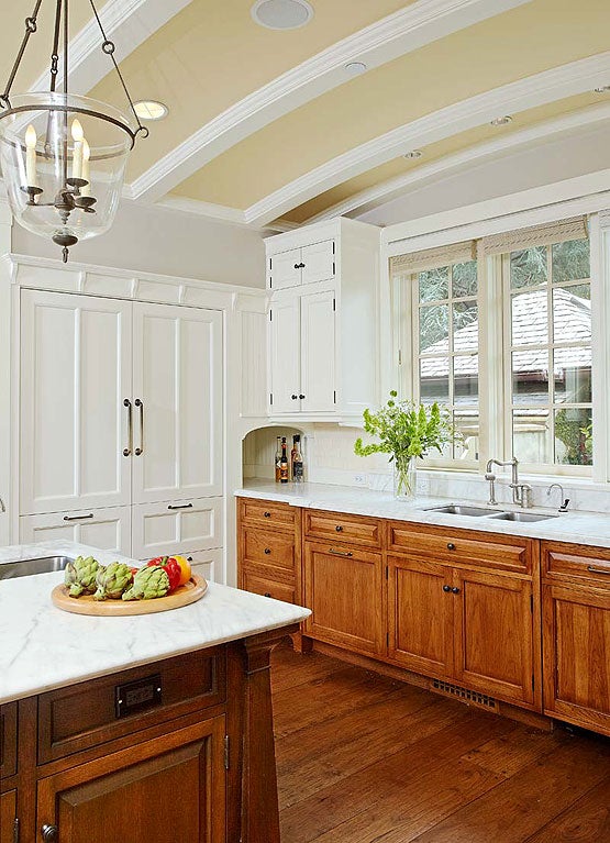 white-marble-countertops-meet-a-backsplash-of-bevel-edged-white-subway-tile.jpg