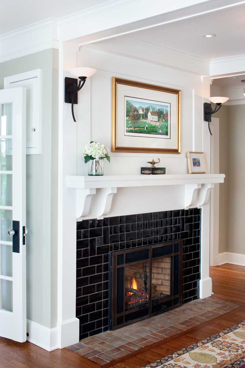 the-gas-fireplace-is-new-but-the-mantelshelf-is-original-contemporary-sconces-nod-to-period-style.jpg