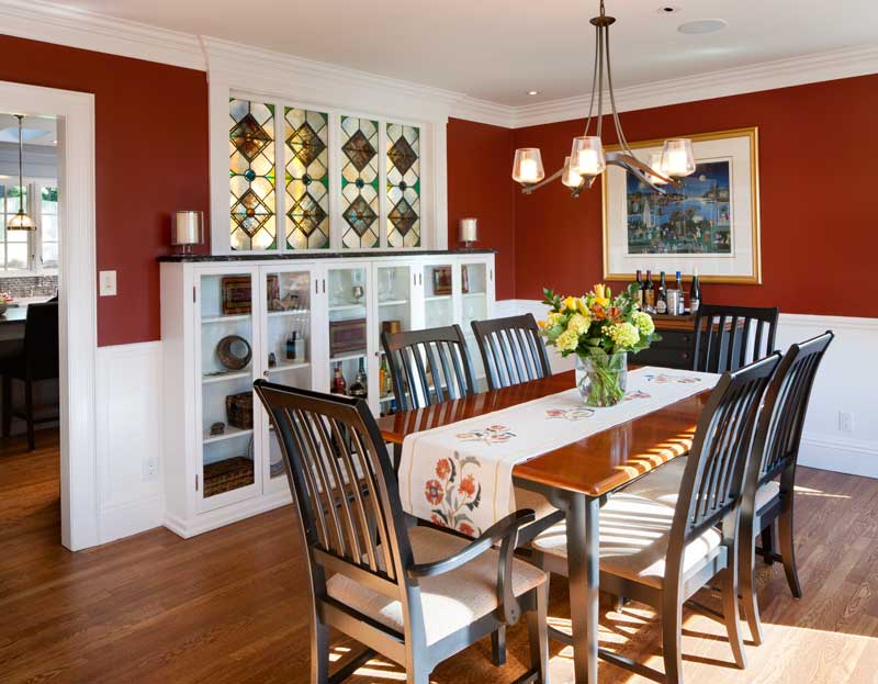 stained-glass-windows-salvaged-from-a-church-allow-light-to-pass-from-dining-room-to-kitchen.jpg