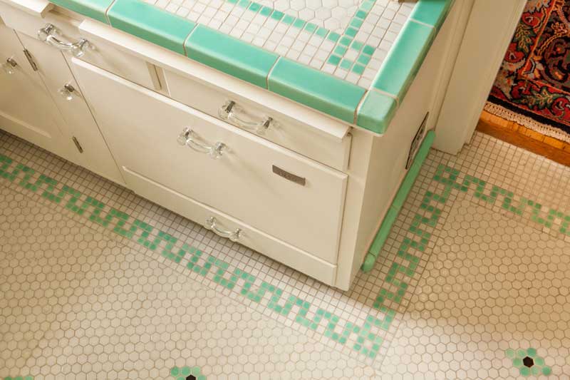 the-counter-top-and-floor-tiles-were-installed-in-the-1930s-the-deep-bin-drawer-now-houses-a-dishwasher.jpg