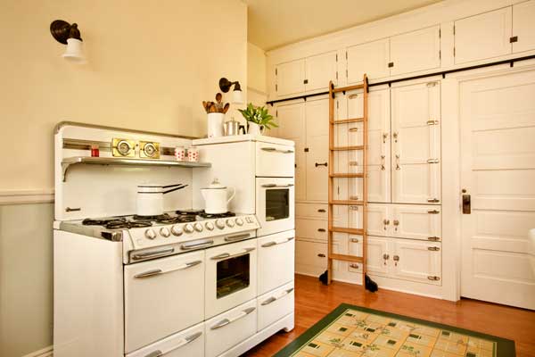 this-wall-originally-held-a-dumbwaiter-and-utility-closet-owner-jack-young-built-the-library-ladder-from-a-kit-it-allows-access-to-the-upper-pantry-cabinets.jpg