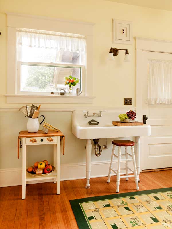 an-old-porcelain-sink-on-legs-smaller-than-the-huge-one-found-in-the-kitchen-allows-access-to-the-door-to-the-back-porch.jpg