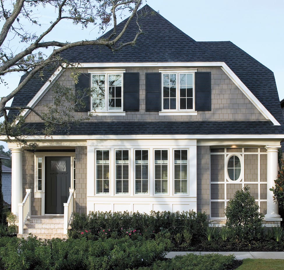 pellas-tall-narrow-lights-in-tall-narrow-sashes-match-period-designs-for-the-grouped-windows-and-sidelights-of-this-english-cottage.jpg