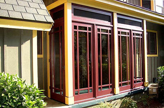 a-three-season-prairie-style-porch-from-touchstone-woodworks-made-of-mahogany-panels-and-well-engineered-for-longevity.jpg
