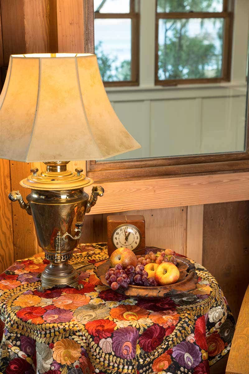mollys-grandmothers-lamp-made-from-a-brass-samovar-rests-on-a-side-table-covered-with-a-vintage-chinese-silk-embroidered-cloth.jpg